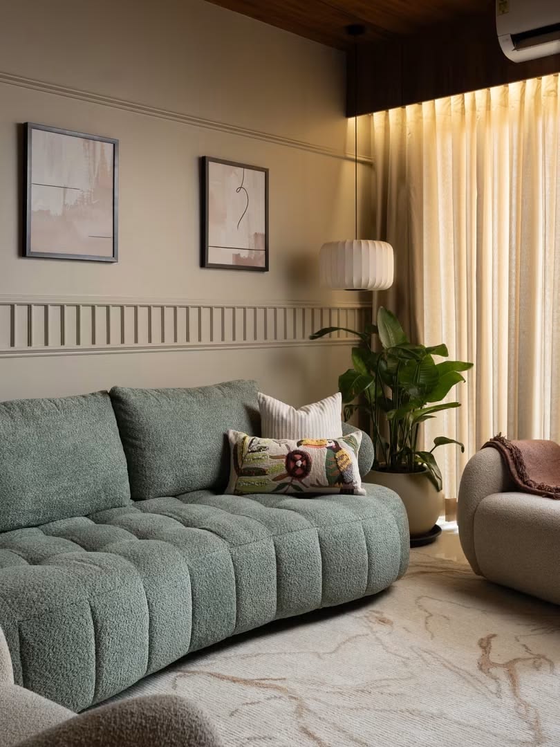 A warm living room styled with rattan and modern art